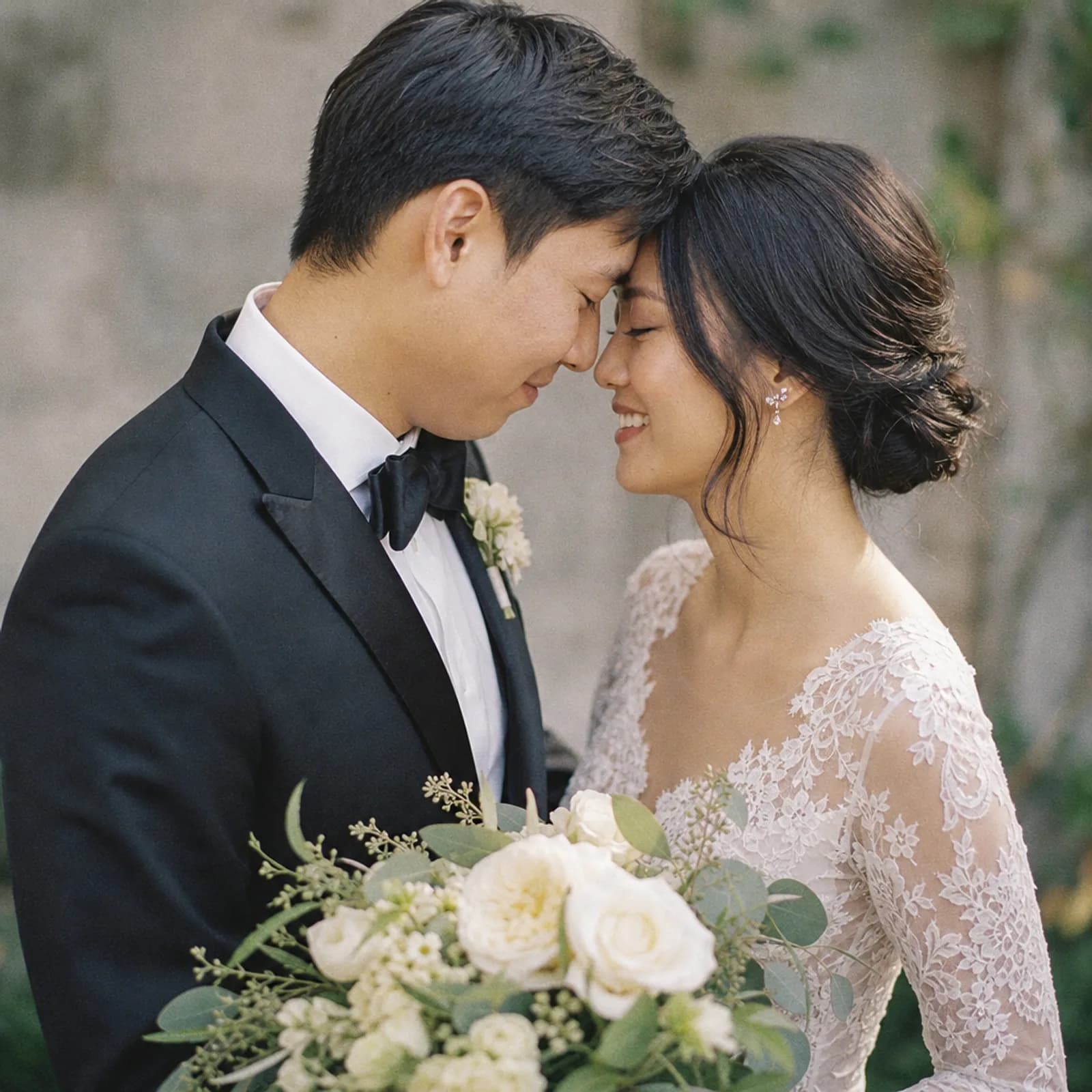 Wedding portrait of the Chen couple, forehead to forehead, from a private client gallery